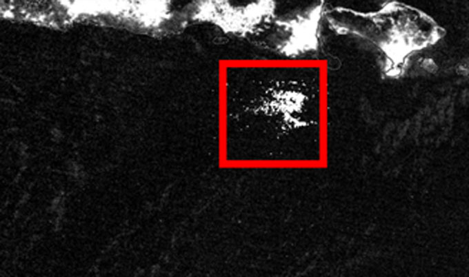 A black and white satellite image has a patch of white inside a red square outline, just below the island of Java (which also shows up white, while the ocean appears black). That patch is a previously unnoticed milky sea in 2017.